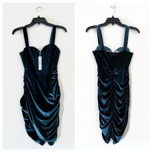 Emerald green velvet dress